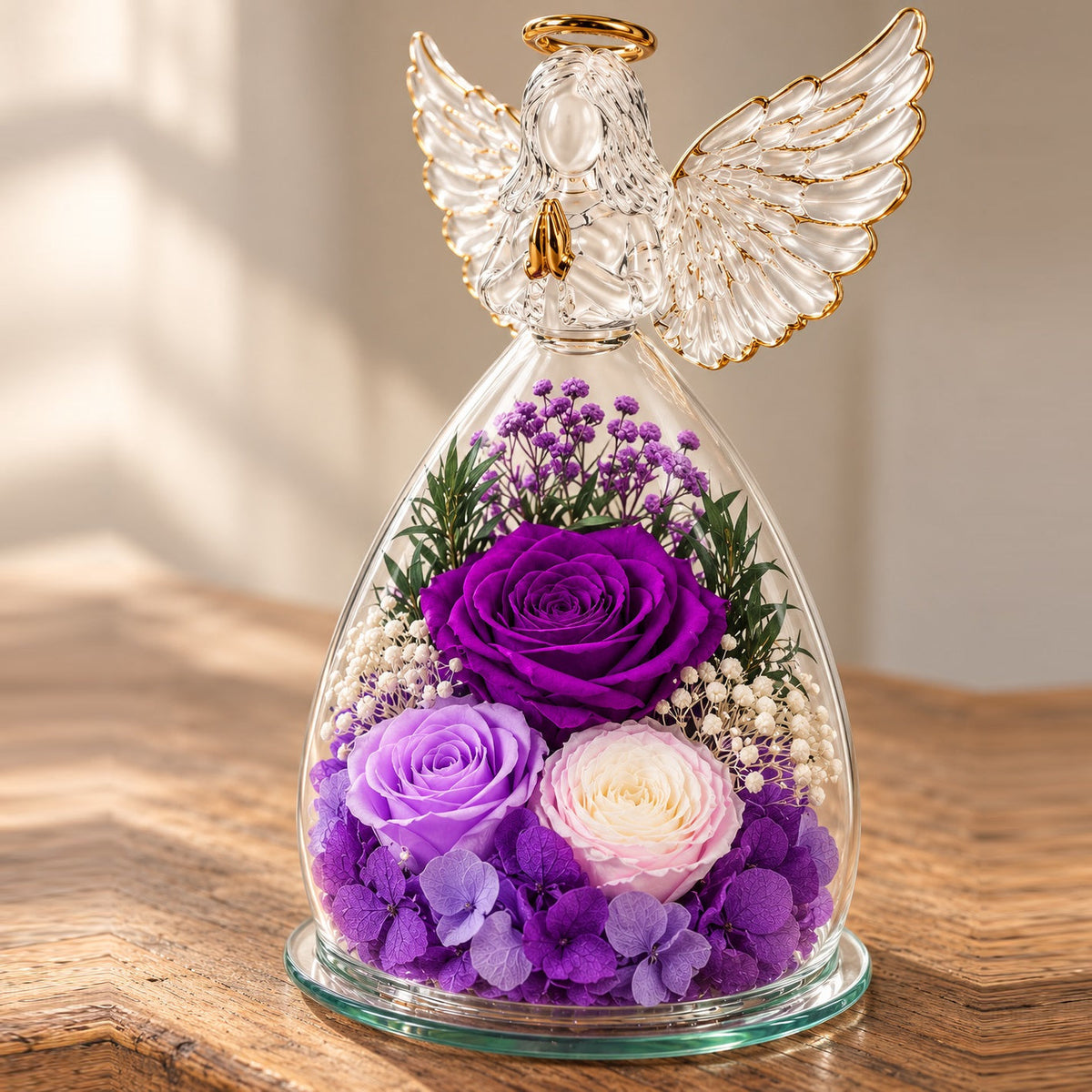 Close view of the purple flowers and feather-wing glass angel