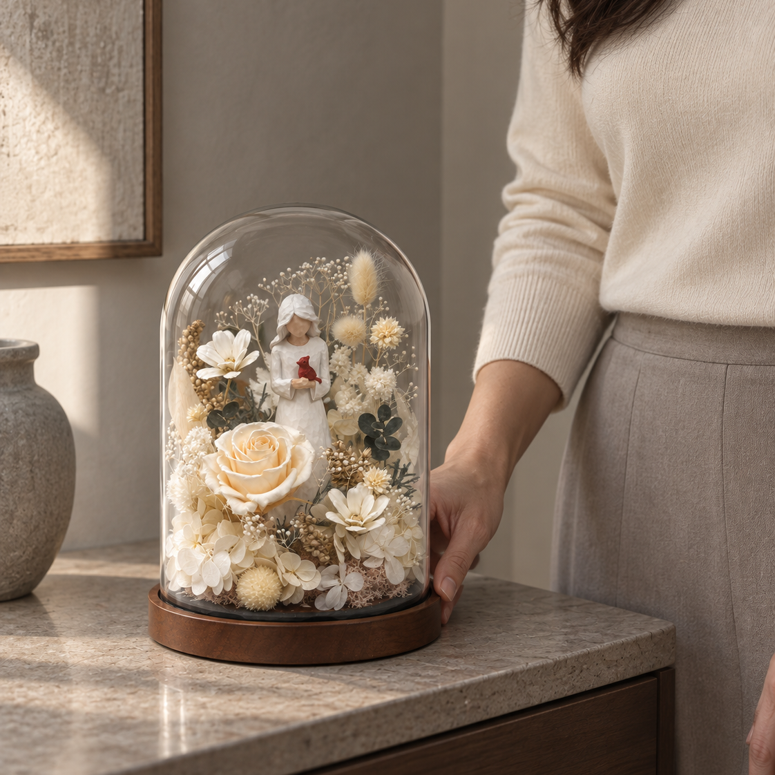 Cardinal glass dome shown beside a hand for scale