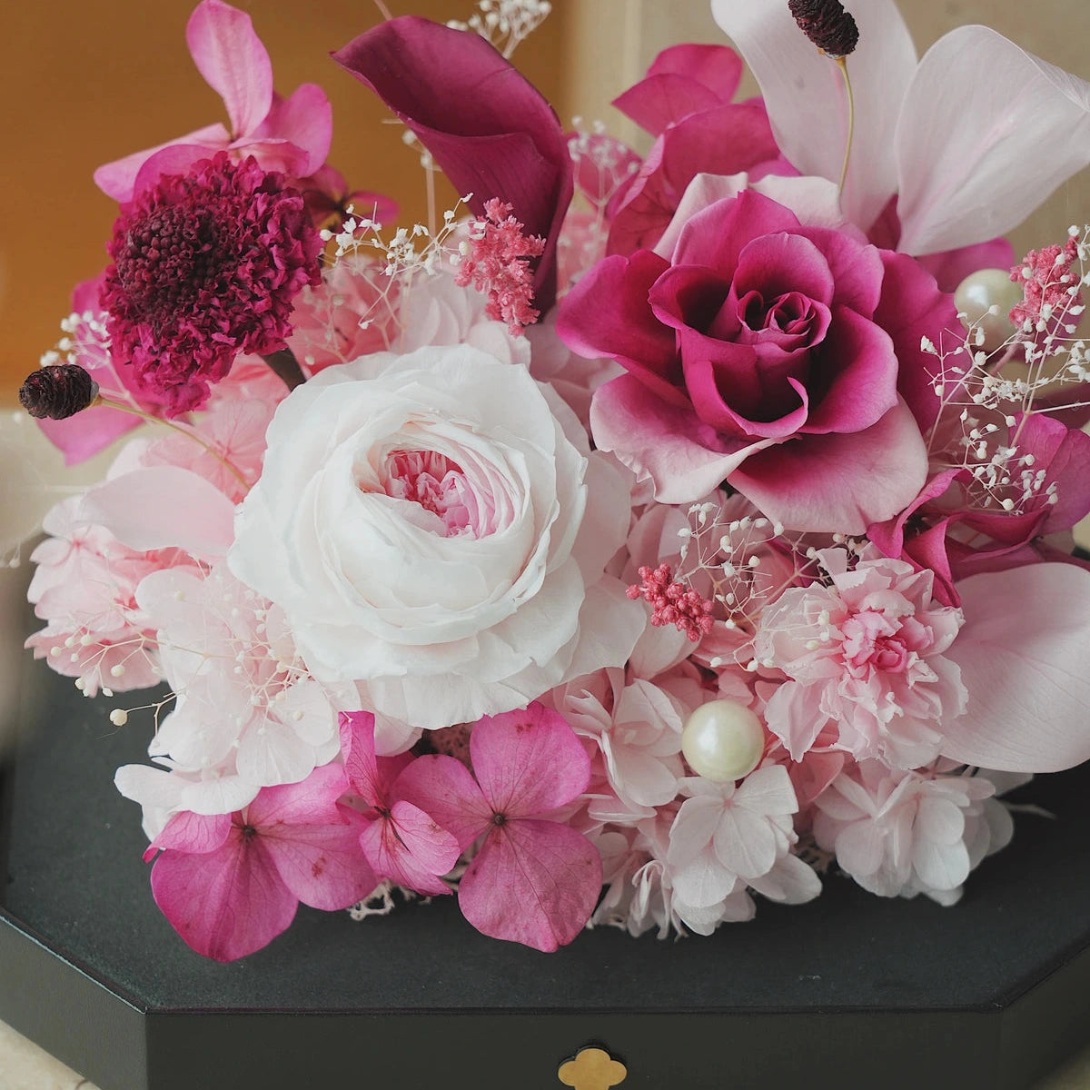 short pink octagonal flower box: flowers without the clear cover