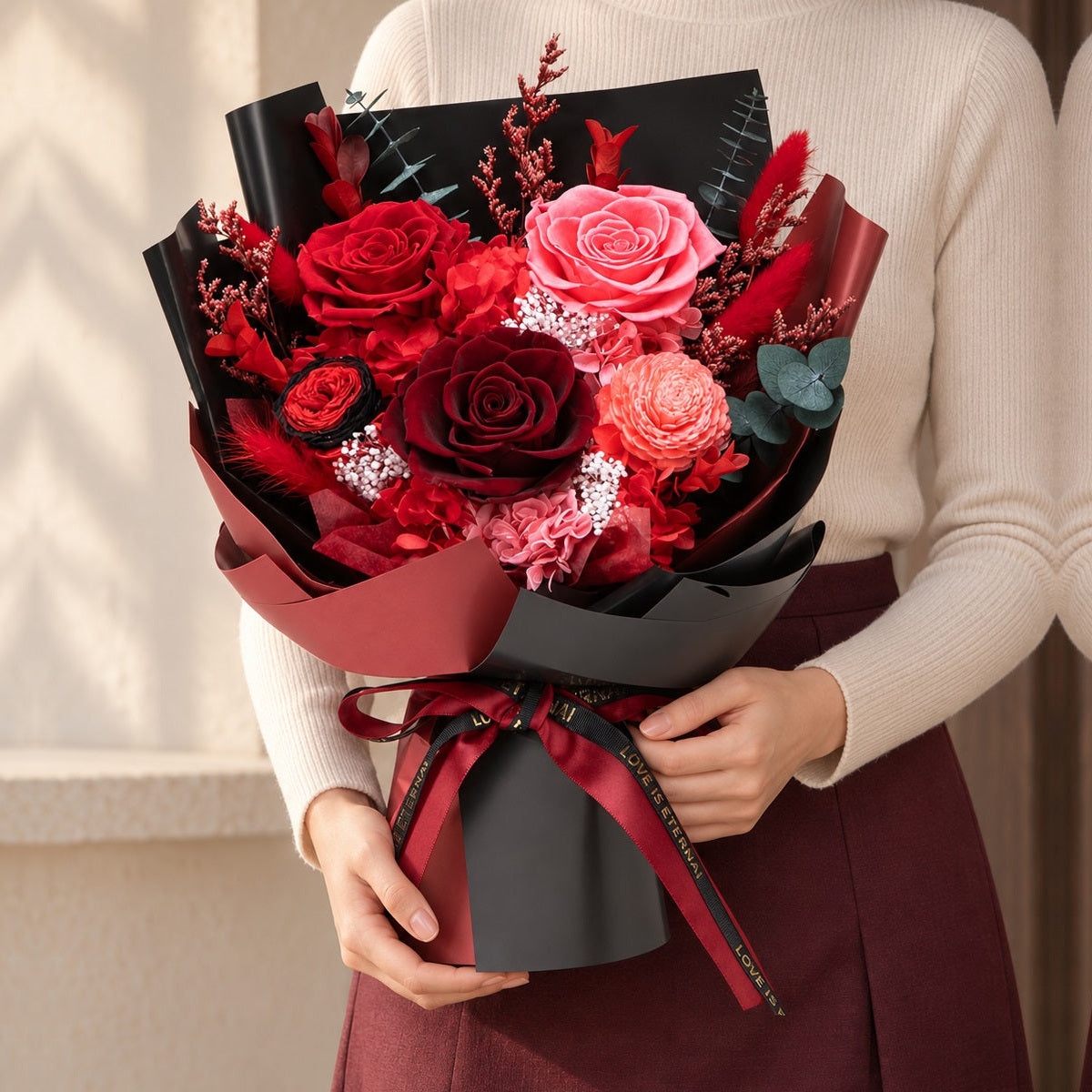 Red Romance Bouquet held by a person for scale