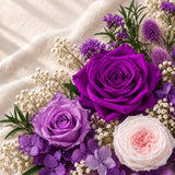 Purple preserved roses and botanical materials