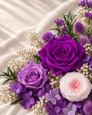 Purple preserved roses and botanical materials