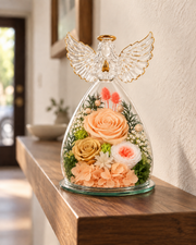 Champagne Angel Wings Keepsake on a walnut wall shelf