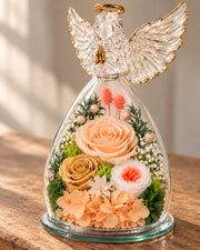 Close view of the champagne flowers and feather-wing glass angel