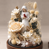 Close detail of the cardinal figurine and preserved flowers