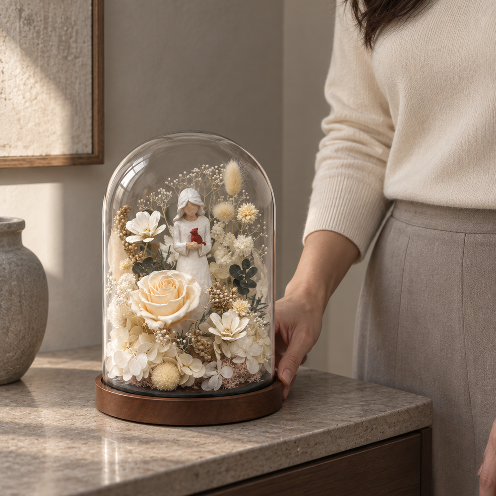 Cardinal glass dome shown beside a hand for scale