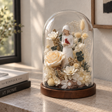 Cardinal glass dome displayed beside books at home