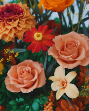 short orange octagonal flower box: flowers without the clear cover