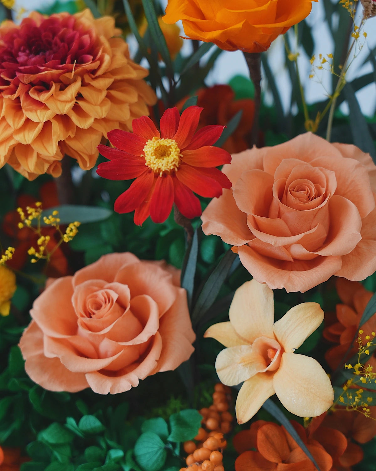 short orange octagonal flower box: flowers without the clear cover