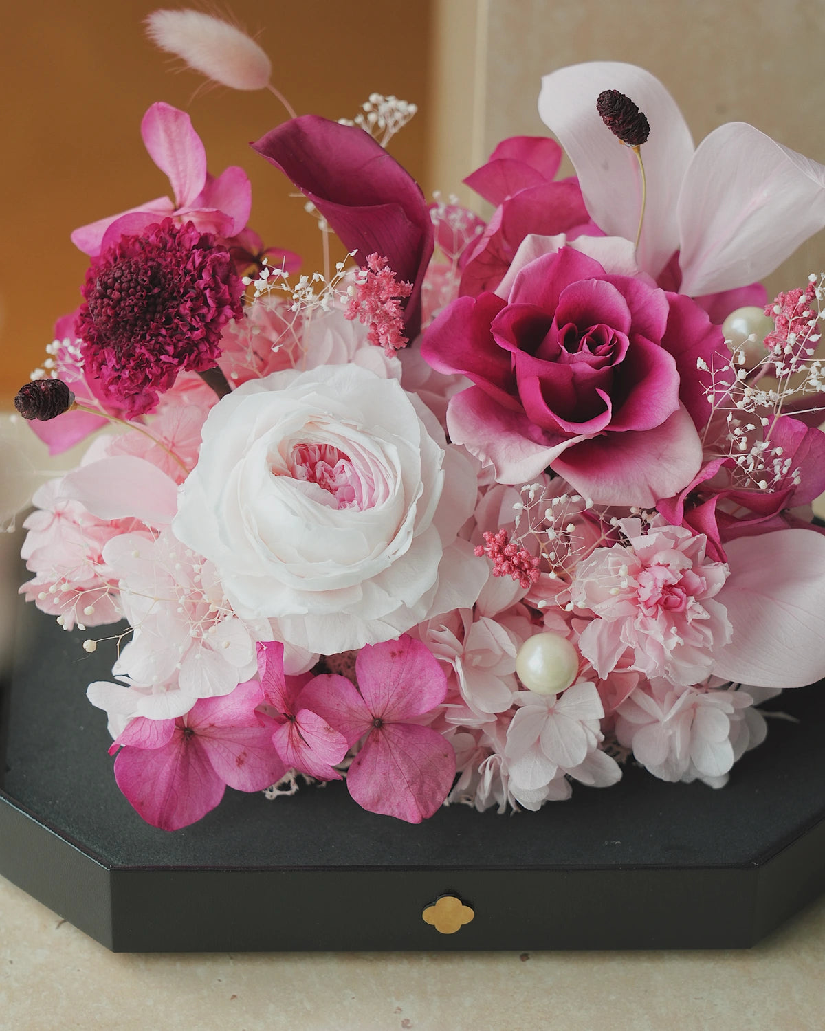 short pink octagonal flower box: flowers without the clear cover
